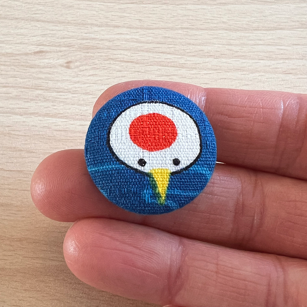 Button blauw kraanvogelkop